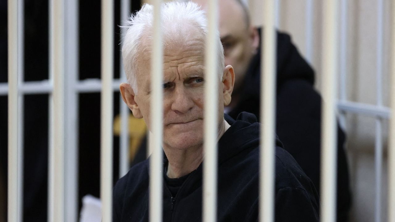 Nobel Prize winner Ales Bialiatski is seen in the defendants' cage in the courtroom at the start of the hearing in Minsk on January 5, 2023. Credit: AFP File Photo