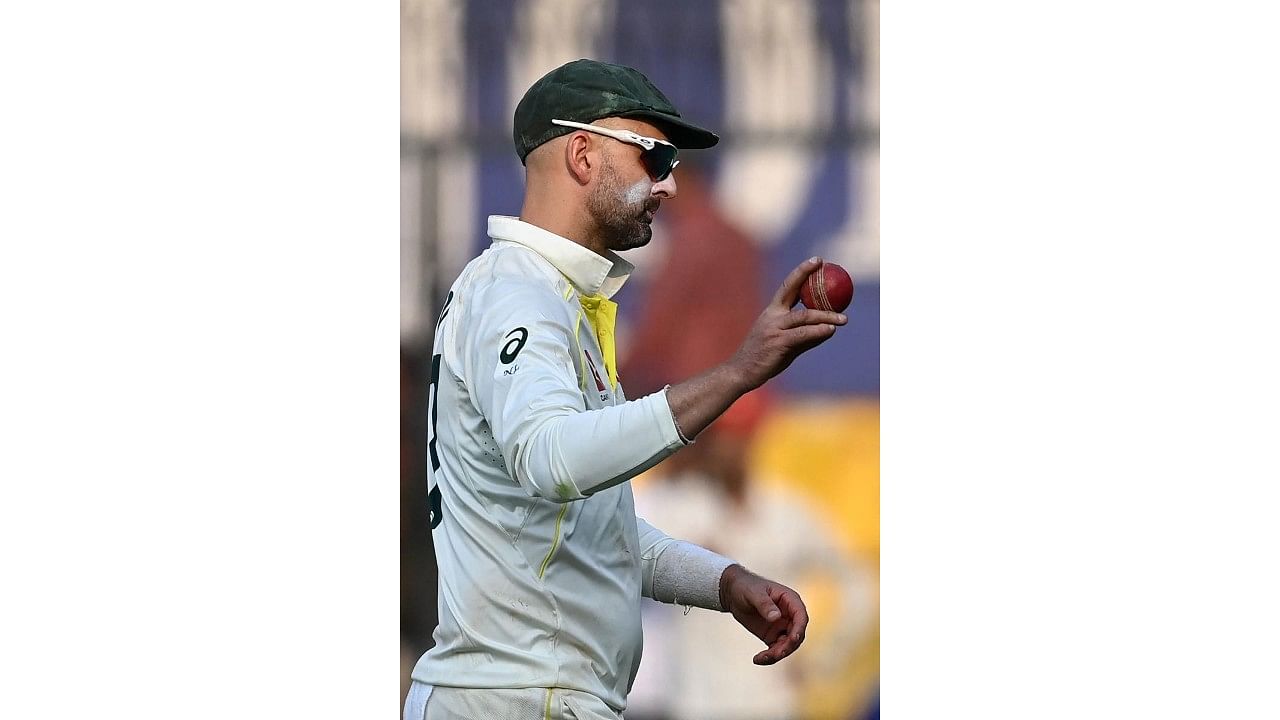 Nathan Lyon acknowledges the crowd after finishing the day with eight wickets. Credit: AFP Photo