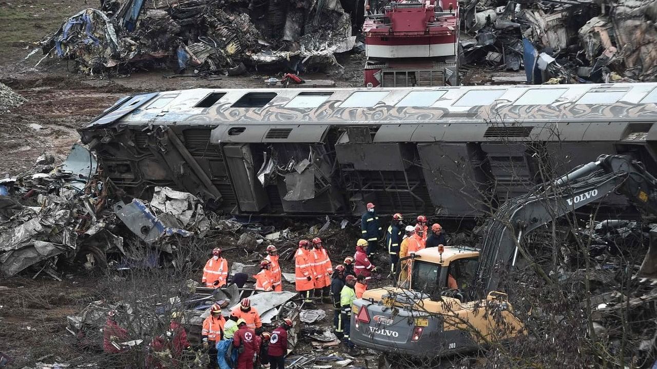 Police and emergency crews examine the debris of a crushed wagon on the second day after a train accident in the Tempi Valley near Larissa, Greece. Credit: AFP Photo