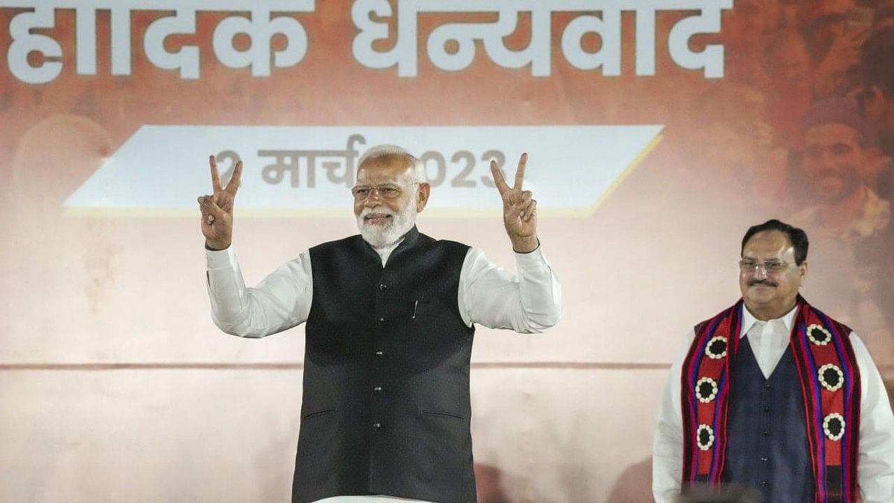 Prime Minister Narendra Modi shows the victory sign during celebrations after the party's performance in Nagaland, Tripura and Meghalaya Assembly polls, at the BJP HQ in New Delhi. Credit: PTI Photo