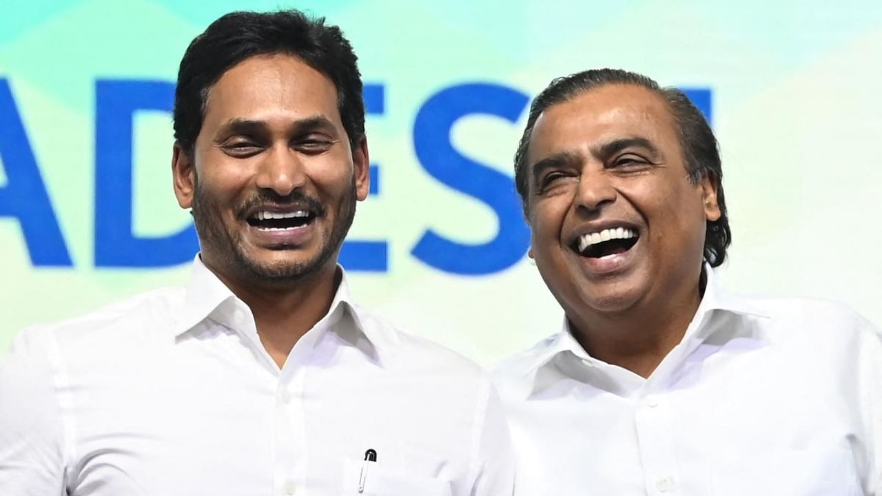 Jagan Mohan Reddy (L), Chief Minister of Andhra Pradesh and Mukesh Ambani (R), Chairman and Managing Director of Reliance Industries Limited at the opening session of the 'Global Investors Summit 2023'. Credit: AFP Photo
