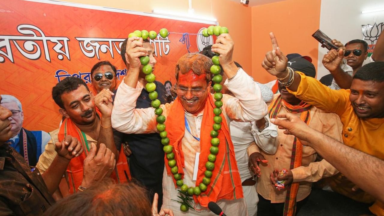 Tripura Chief Minister Manik Saha being garlanded by BJP supporters after the party's good performance in the Assembly elections, in Agartala. Credit: PTI Photo