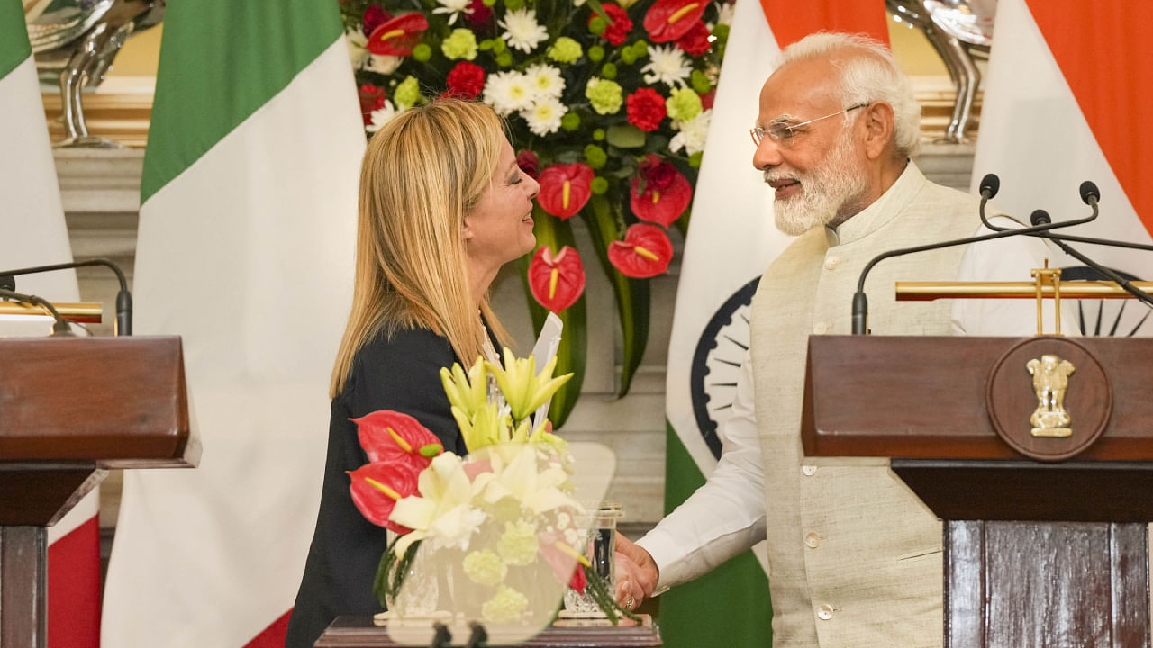 Prime Minister Narendra Modi greets Prime Minister of Italy Giorgia Meloni during their joint press statement after a meeting at the Hyderabad House. Credit: PTI Photo