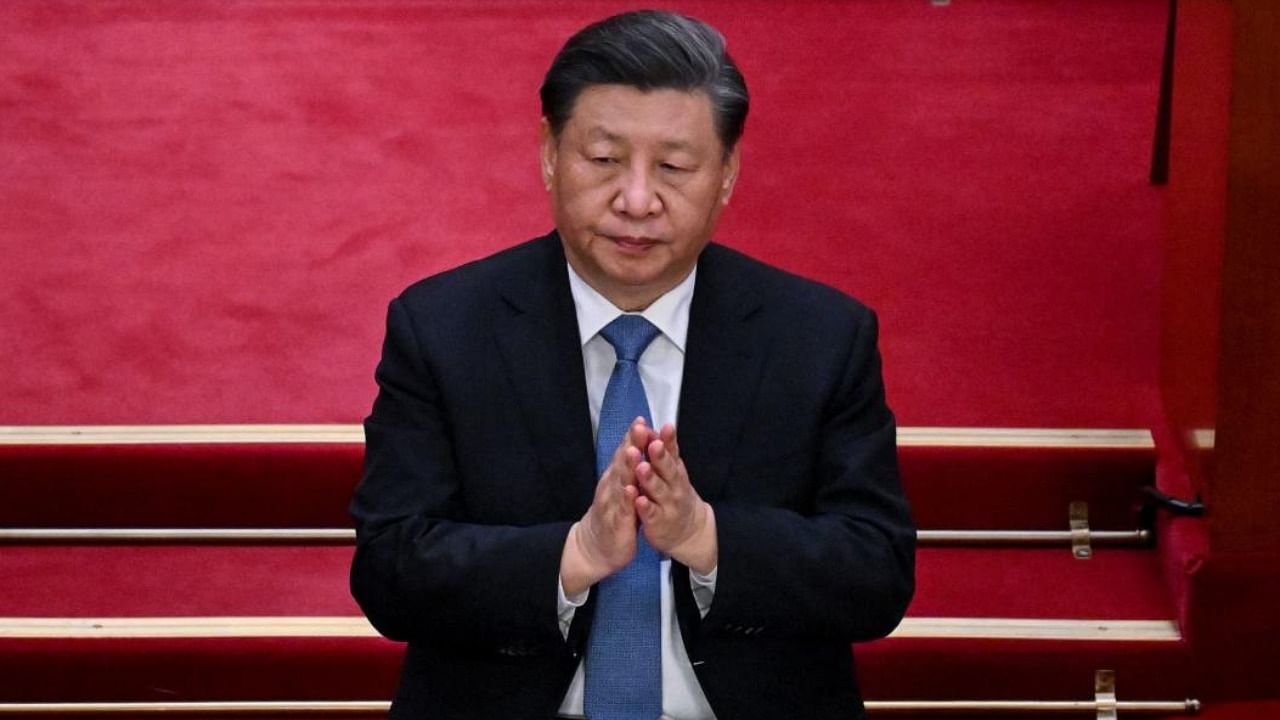 China's President Xi Jinping applauds during the opening ceremony of the Chinese People's Political Consultative Conference (CPPCC) in Beijing. Credit: AFP Photo