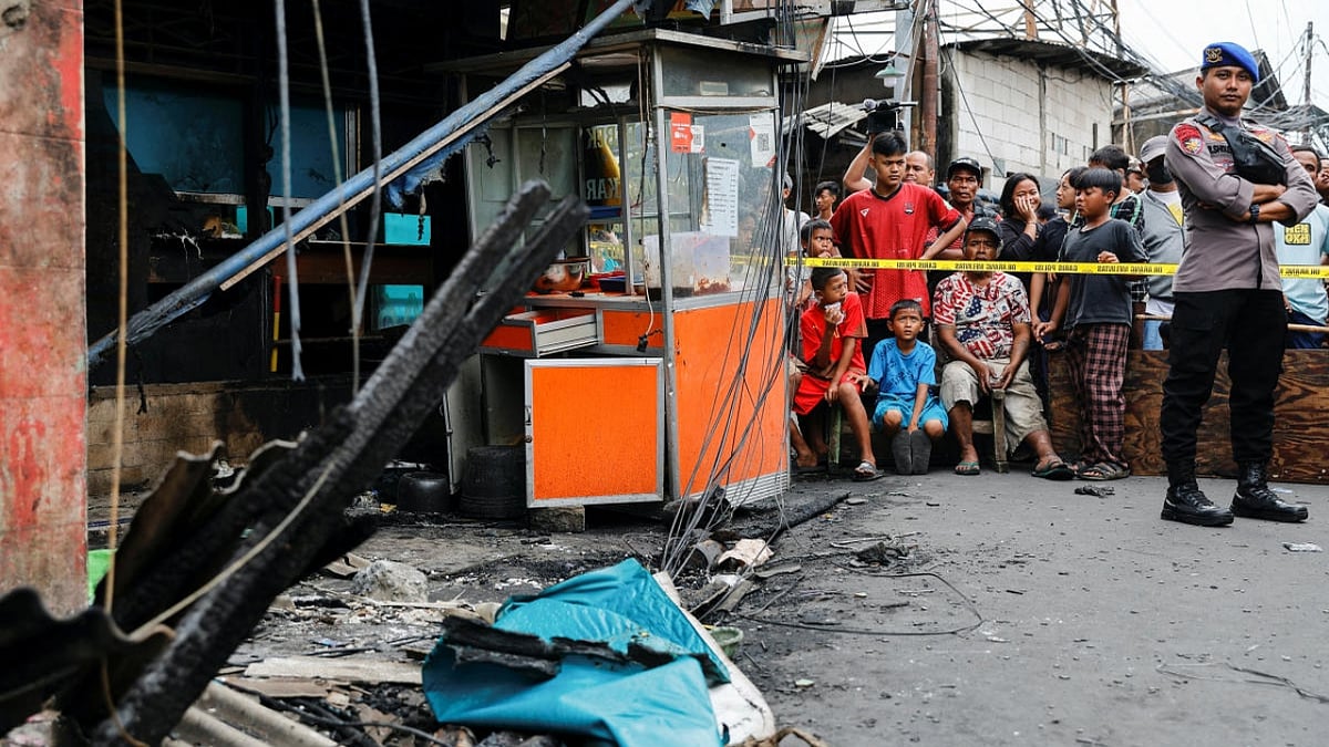 Indonesians search charred homes after fuel depot fire kills 17