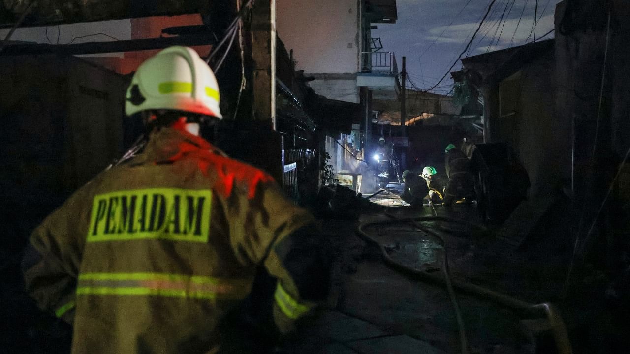 Firefighters work during an operation after a fire broke out at a fuel storage station operated by Indonesia's state energy company Pertamina, in Jakarta, Indonesia, March 3, 2023. Credit: Reuters Photo