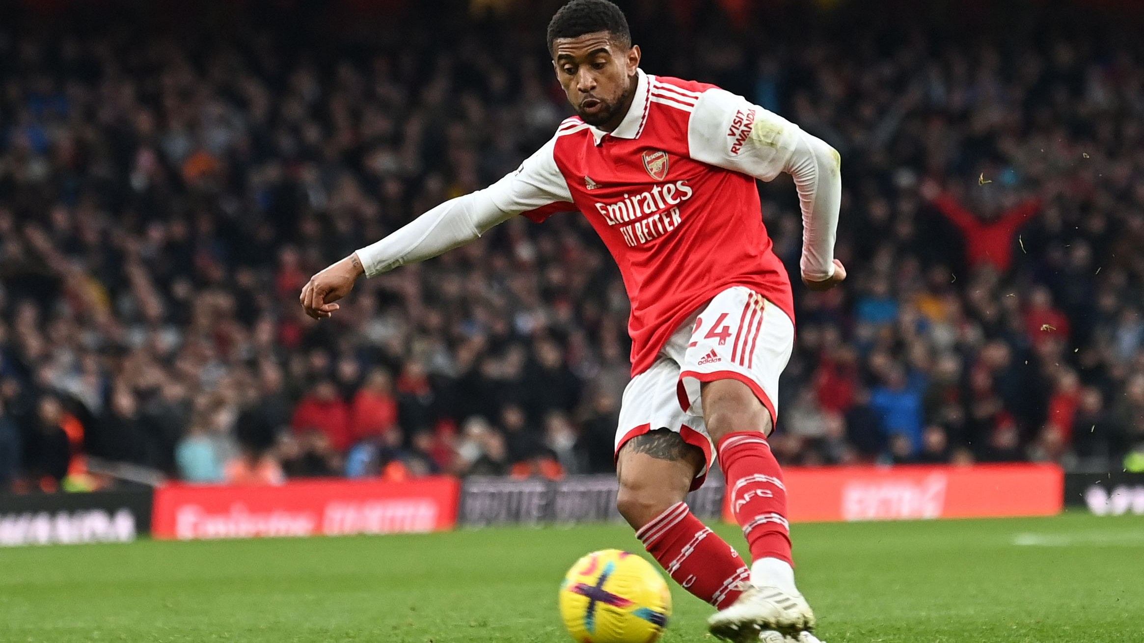 Arsenal's English midfielder Reiss Nelson shoots and scores the third goal of the team during the English Premier League football match between Arsenal and Bournemouth. Credit: AFP Photo