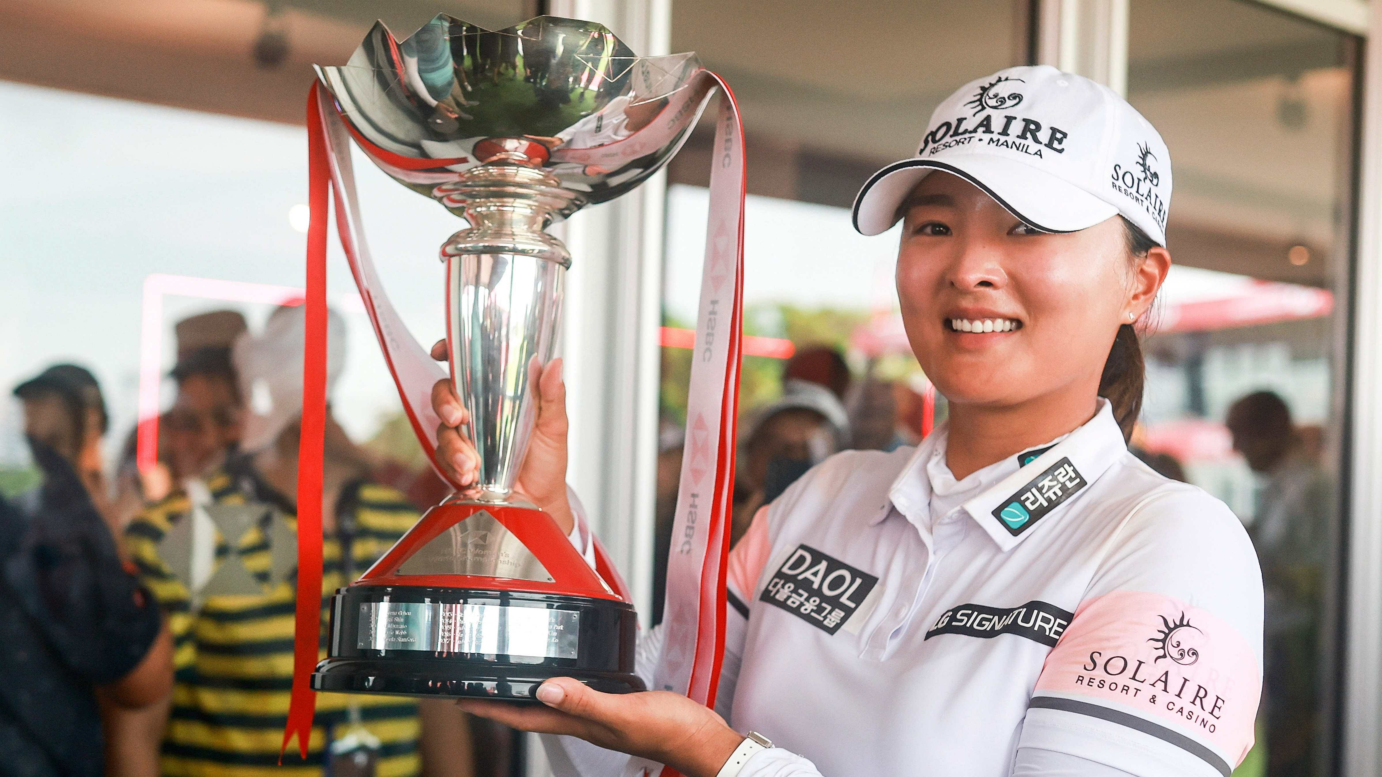Jin Young Ko of South Korea poses with the trophy after winning the HSBC Women's World Championship. Credit: AP Photo