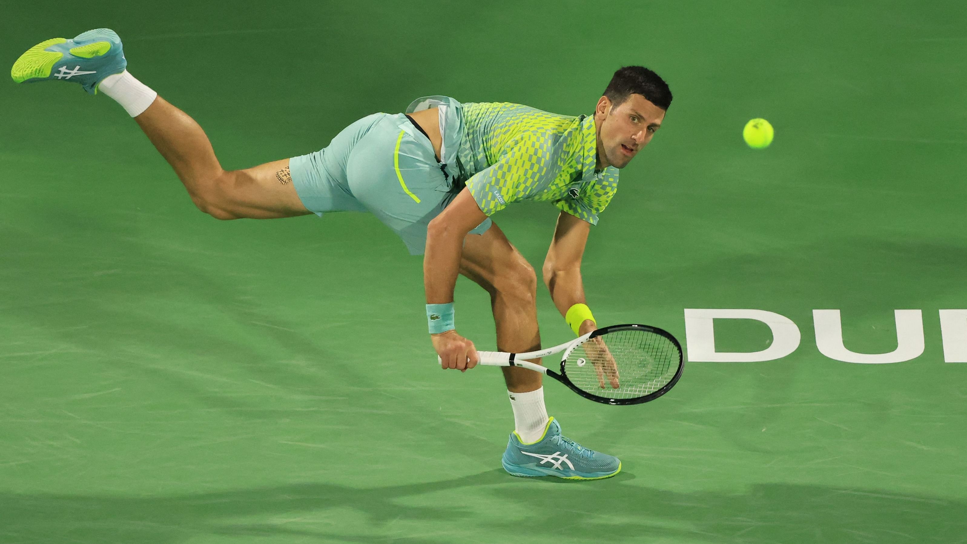 Serbia's Novak Djokovic hits a return against Russia's Daniil Medvedev. Credit: AFP Photo