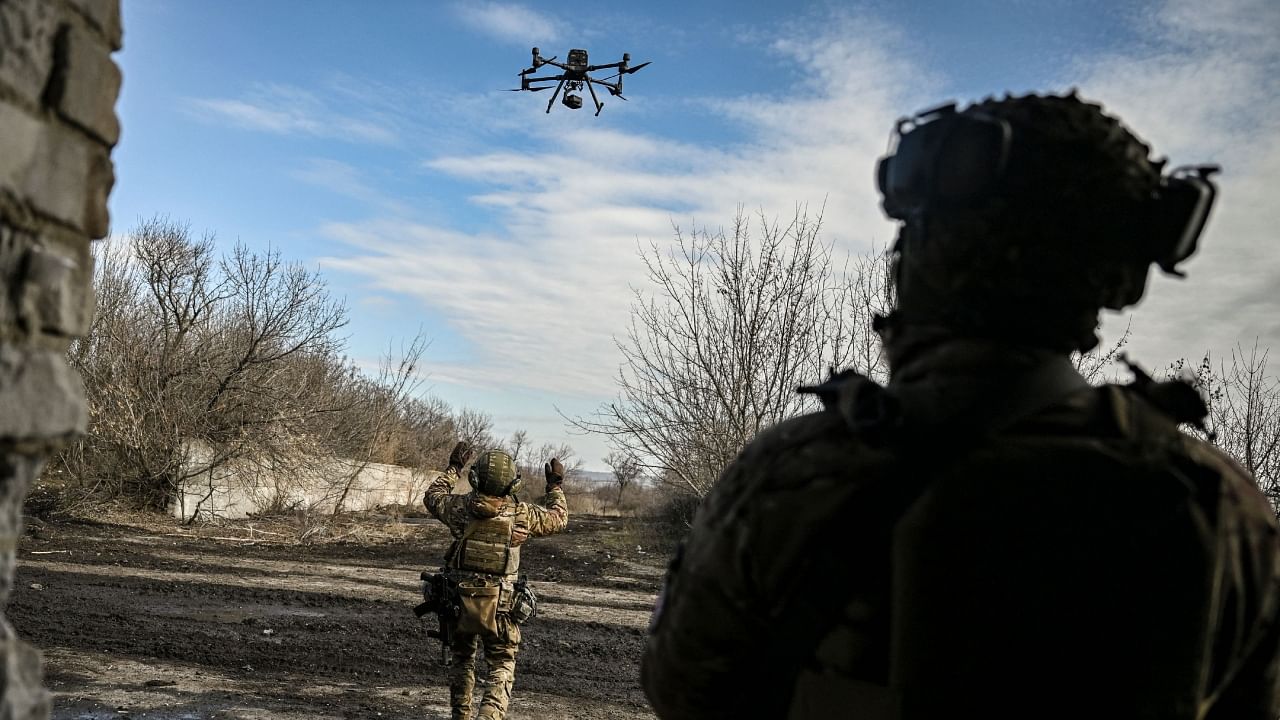 A Ukrainian serviceman flies a drone to spot Russian positions near the city of Bakhmut, in the region of Donbas, on March 5, 2023. Credit: AFP Photo