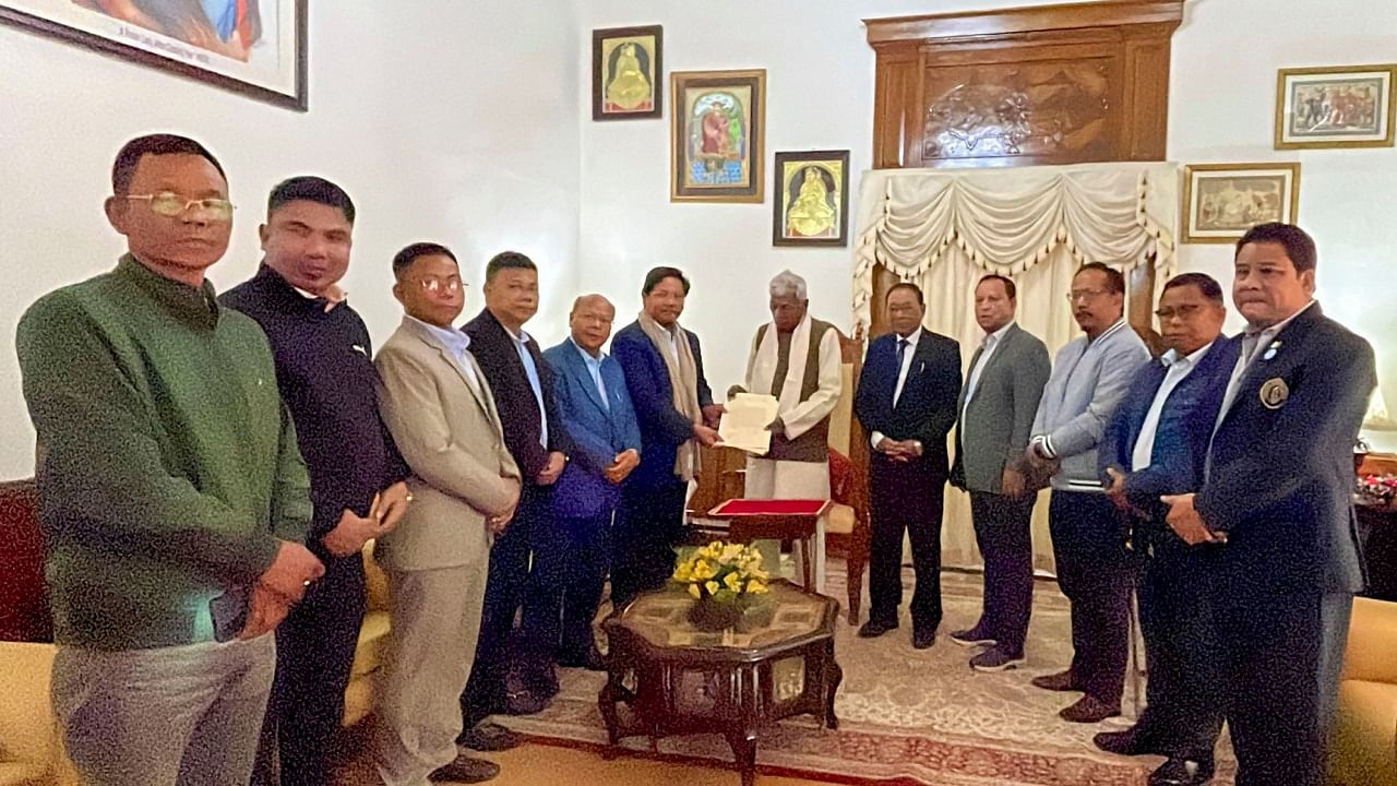 Meghalaya Governor Phagu Chauhan congratulates Pro-tem Speaker of the Meghalaya Legislative Assembly T D Shira after administering oath, in Shillong, Sunday, March 5, 2023. Credit: PTI Photo