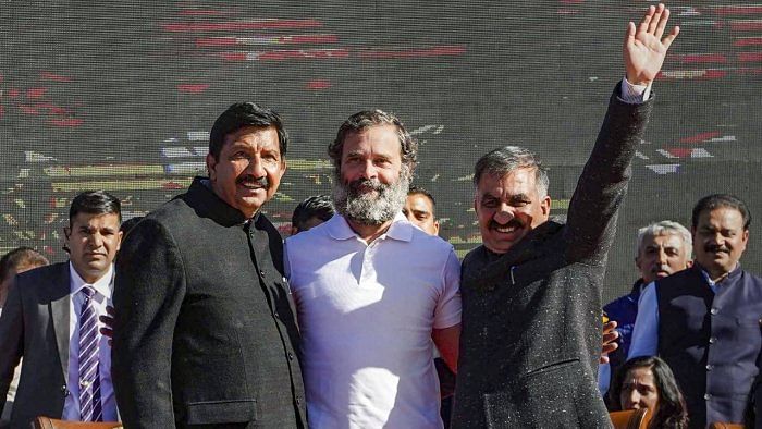 Sukhwinder Singh Sukhu and his deputy Mukesh Agnihotri with Congress leader Rahul Gandhi after the swearing-in ceremony, in Shimla. Credit: PTI Photo  