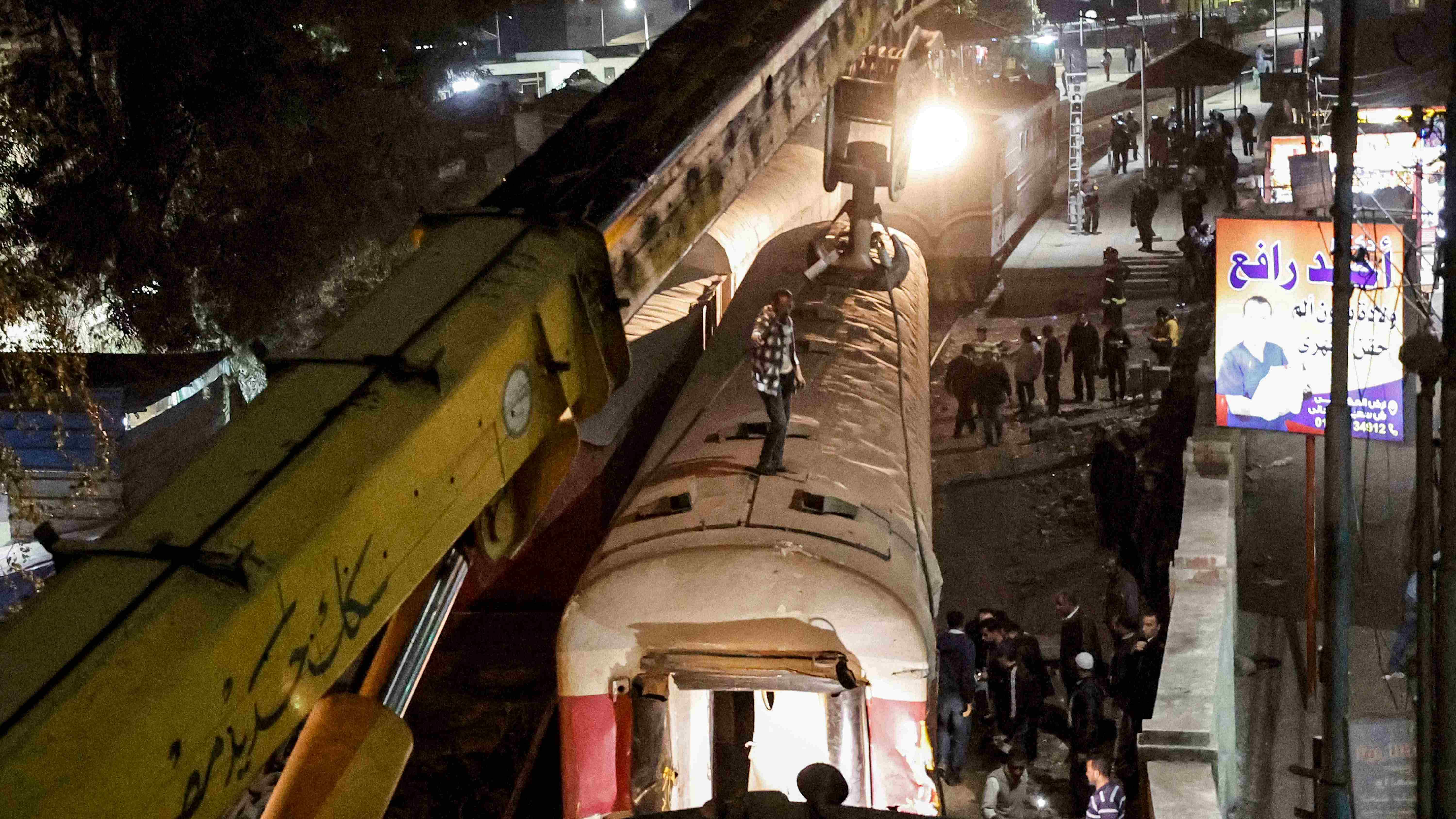 A crane is deployed to lift a derailed train at the scene of a railroad accident in the city of Qalyub in Qalyub province, in Egypt's Nile delta region north of the capital. Credit: AFP Photo