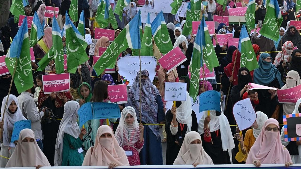 Activists of right-wing religious Jamaat-e-Islami (JI) party hold a so-called modesty march in opposition to International Women's Day in Lahore on March 8, 2023. Credit: AFP Photo