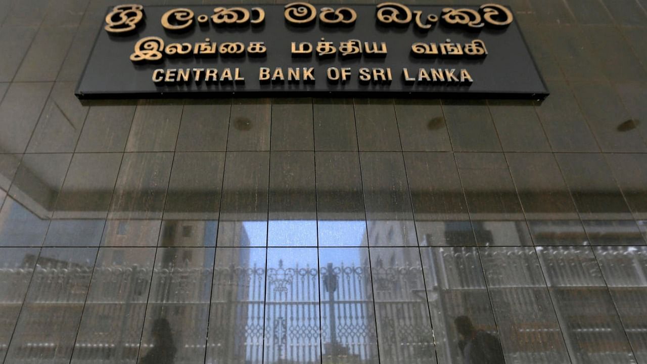 People walk past the main entrance of the Sri Lanka's Central Bank in Colombo. Credit: Reuters Photo