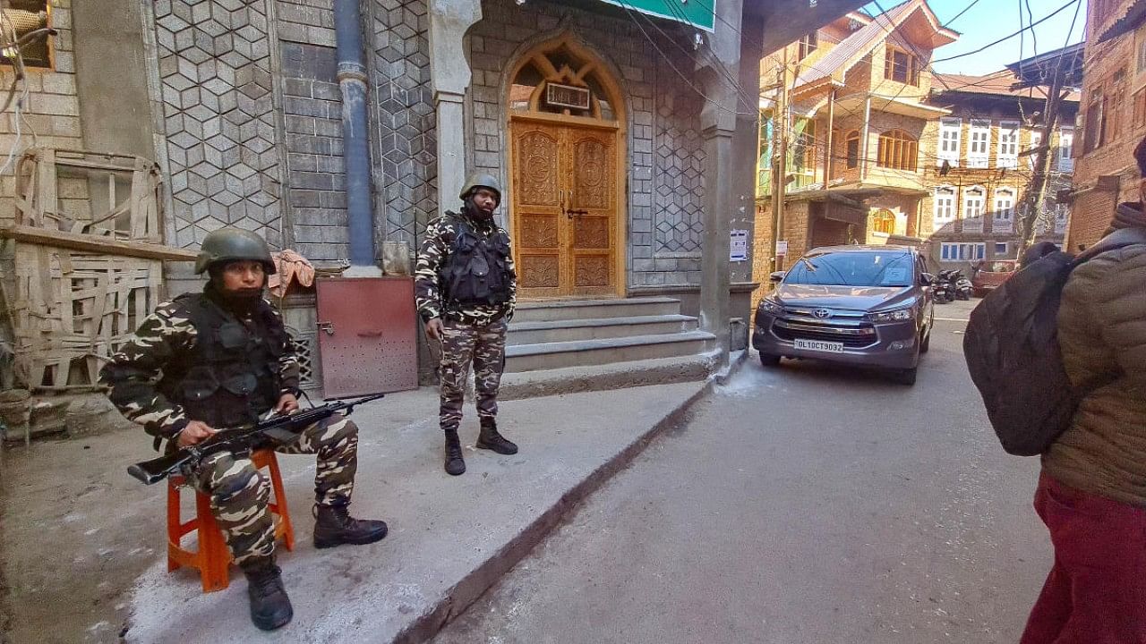 Security personnel during a raid at the residence of Hurriyat leader Qazi Yasir by the Enforcement directorate (ED) in a case linked to allotment of MBBS seats in Pakistan, in Anantnag district. Credit: PTI Photo