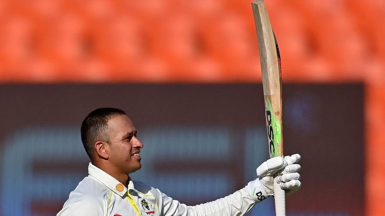 Australia's Usman Khawaja celebrates after scoring a century (100 runs) during the first day of the fourth and final Test cricket match between India and Australia. Credit: AFP Photo