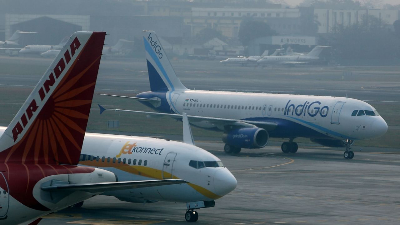 An IndiGo Airlines Airbust A320 aircraft and JetKonnect Boeing 737 aircraft taxi past an Air India Airbus A321 aircraft at Mumbai's Chhatrapathi Shivaji International Airport, February, 2013. Representative Image. Credit: Reuters File Photo