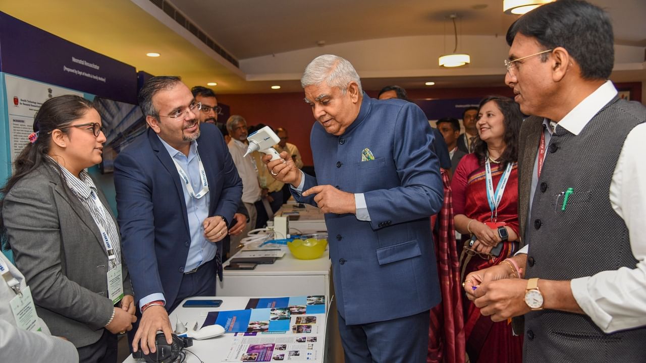 Vice President Jagdeep Dhankhar and Union Health Minister Mansukh Mandaviya visit the 'Market Place' at the inauguration of the International Symposium on Health Technology Assessment 2023, in New Delhi. Credit: PTI Photo