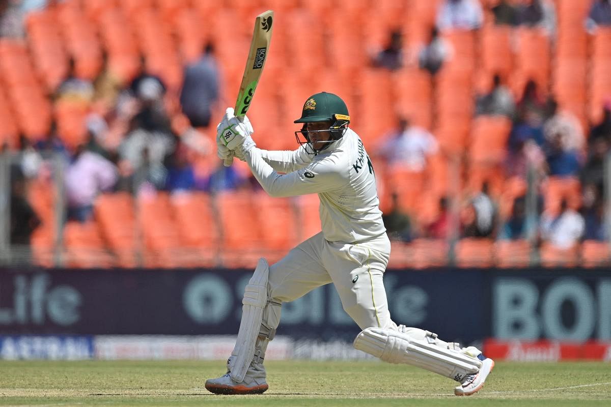 Australia's Usman Khawaja drives during his unbeaten century on day one of the fourth Test against India in Ahmedabad. Credit: AFP Photo