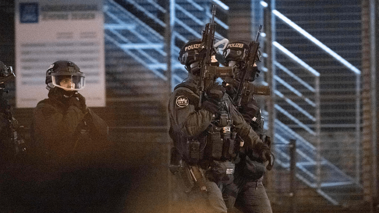 Armed police patrol outside a Jehovah's Witnesses church where several people have been killed in a shooting in Hamburg, northern Germany. Credit: AFP Photo