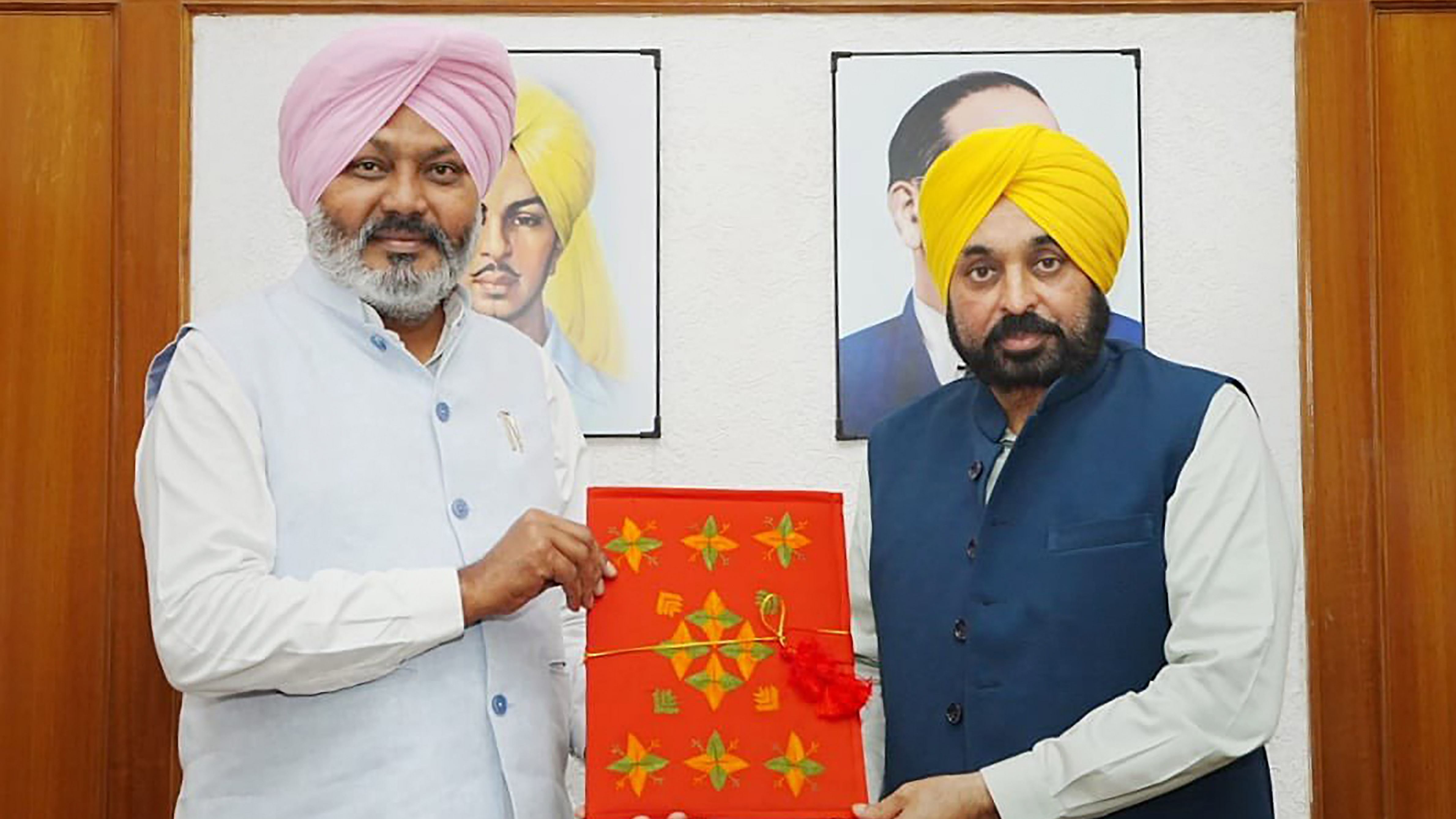 Punjab Chief Minister Bhagwant Mann and Finance Minister Harpal Singh Cheema with Punjab Budget for FY 2023-24. Credit: PTI Photo