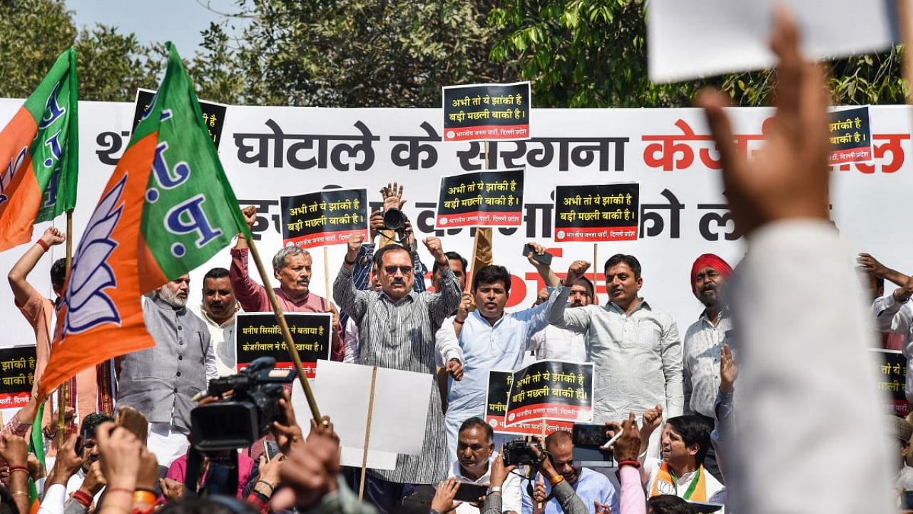 Delhi BJP Working President Virendra Sachdeva with party leaders and workers raises slogans during a protest against the Delhi Government, near AAP headquarters in New Delhi. Credit: PTI Photo