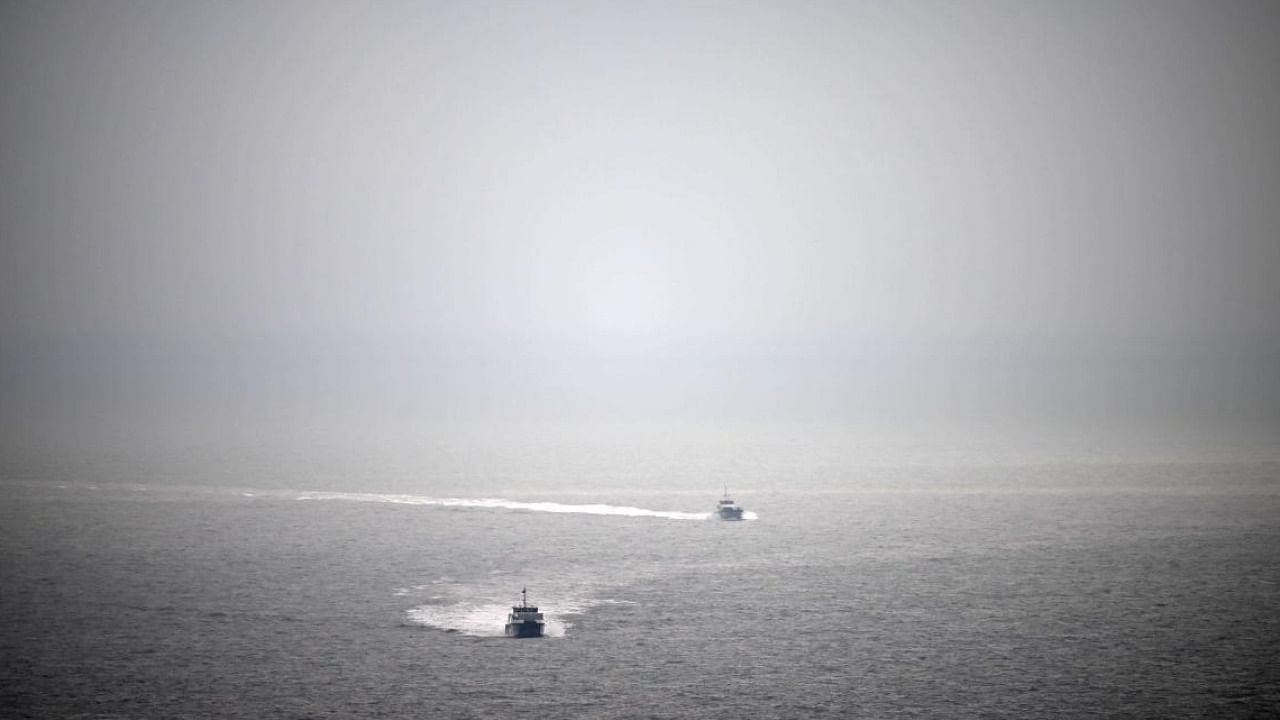 Migrants picked up at sea while attempting to cross the English Channel, are escorted on UK Border Force vessels. Credit: AFP File Photo