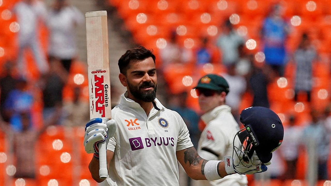 Virat Kohli celebrates his ton. Credit: Reuters Photo