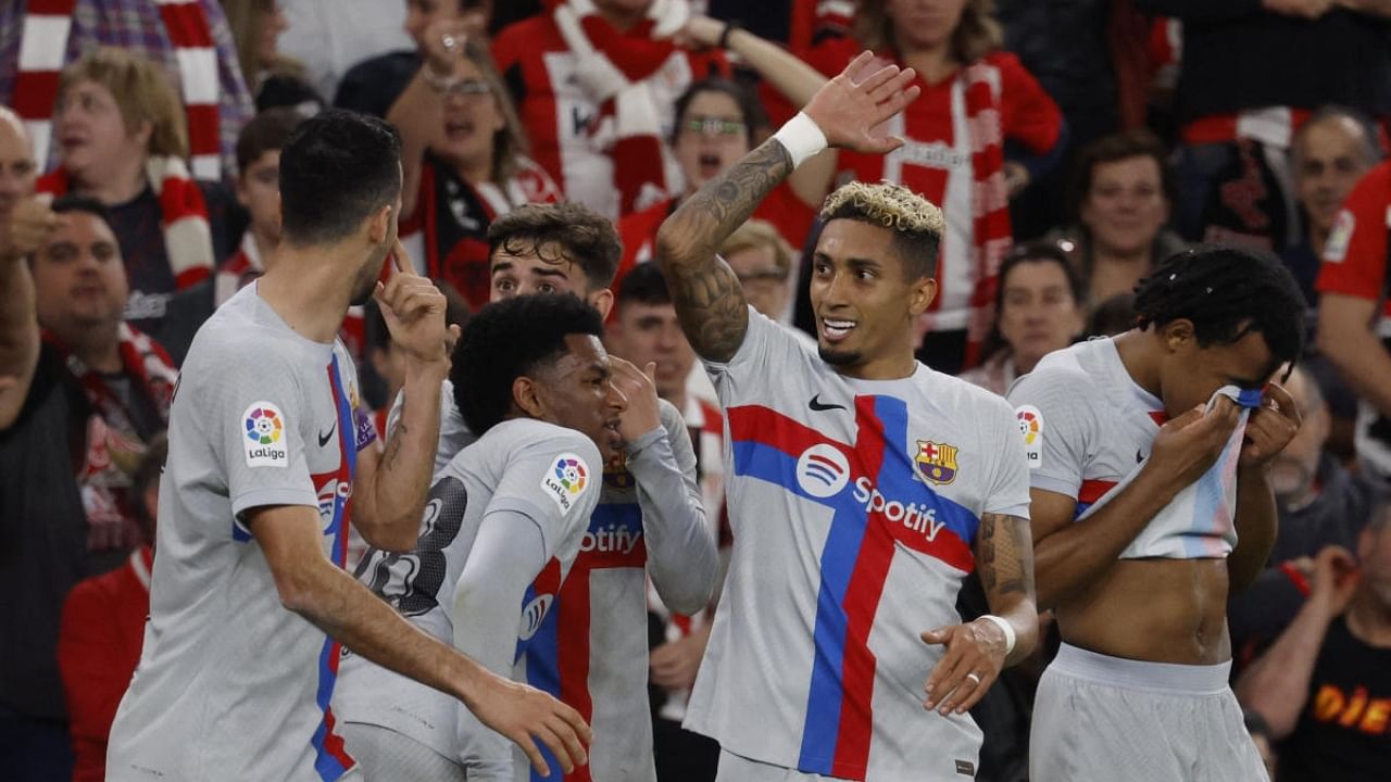 Barcelona's Raphinha celebrates scoring their first goal with teammates. Credit: Reuters Photo