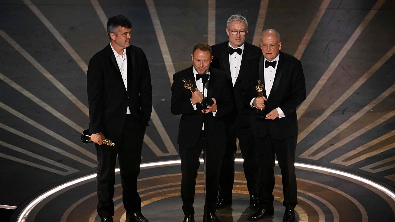 US visual effects artist Richard Baneham (C) accepts the Oscar for Best Visual Effects for 'Avatar: The Way of Water' onstage during the 95th Annual Academy Awards at the Dolby Theatre in Hollywood, California on March 12, 2023. Credit: AFP Photo