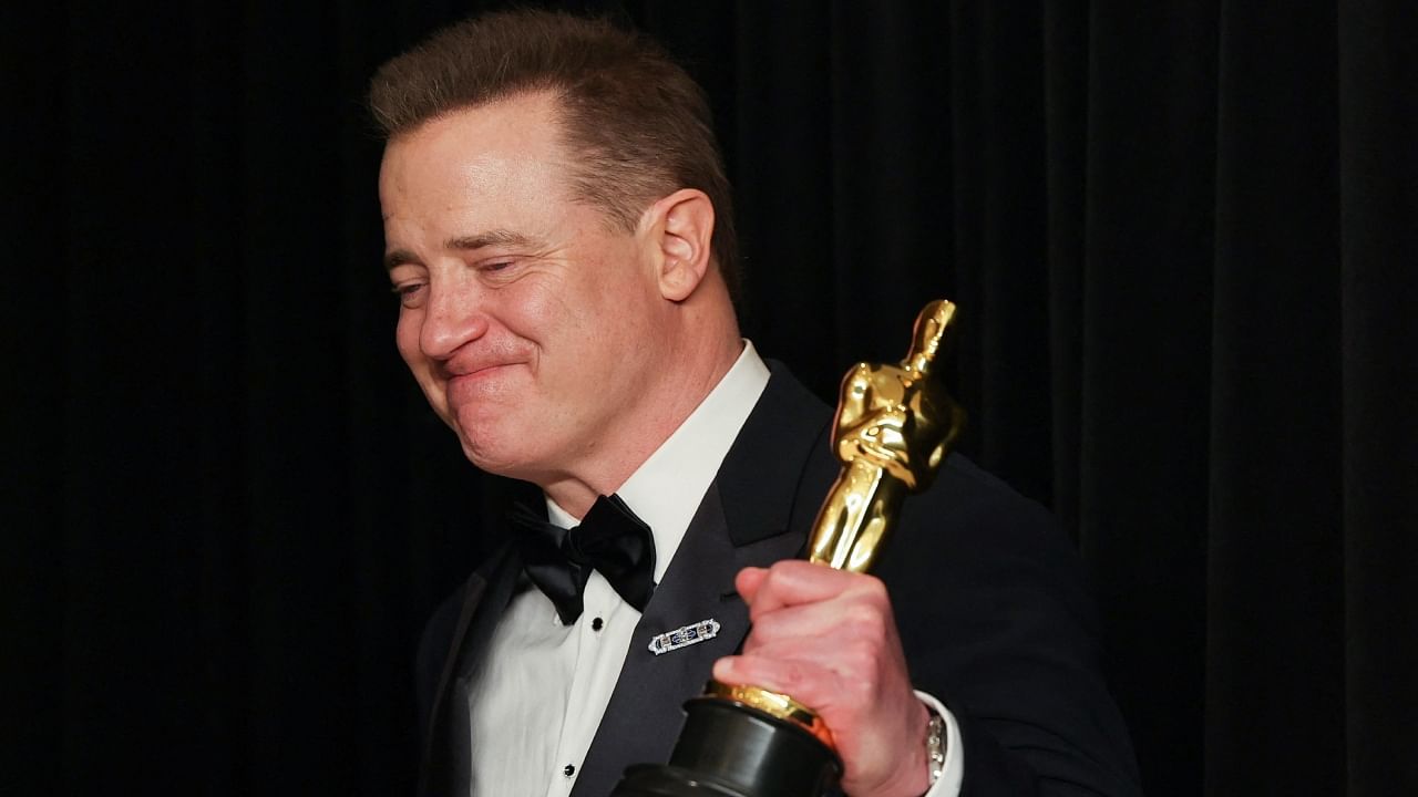 Best Actor winner Brendan Fraser celebrates with his Oscar backstage at the 95th Academy Awards in Hollywood, Los Angeles, California, March 12, 2023. Reuters File Photo