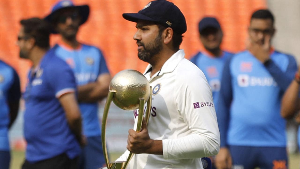 Rohit Sharma receives the Border Gavaskar trophy after winning the test series. Credit: Reuters Photo