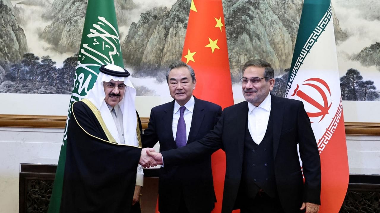 Wang Yi, a member of the Political Bureau of the Communist Party of China (CPC) Central Committee and director of the Office of the Central Foreign Affairs Commission, Ali Shamkhani, the secretary of Iran’s Supreme National Security Council, and Minister of State and national security adviser of Saudi Arabia Musaad bin Mohammed Al Aiban pose for pictures during a meeting in Beijing. Credit: Reuters Photo