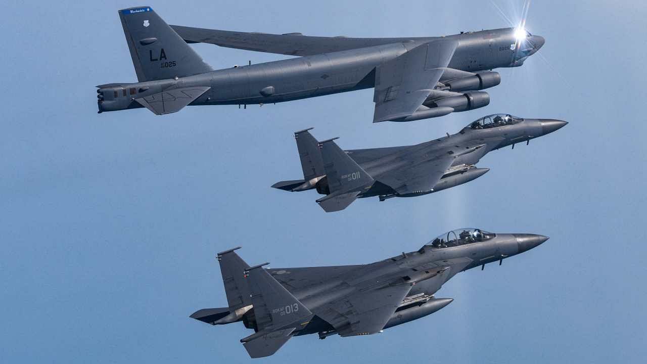 US Air Force B-52H bomber flying over the western sea of the Korean Peninsula with two South Korean Air Force F-15K fighter jets during a joint air drill in South Korea. Credit: AFP Photo