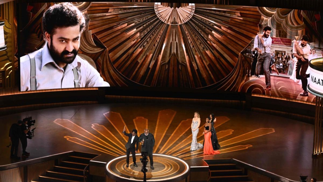 M.M. Keeravaani (R) and Indian musician Chandrabose accept the Oscar for Best Music (Original Song) for 'Naatu Naatu'. Credit: AFP Photo