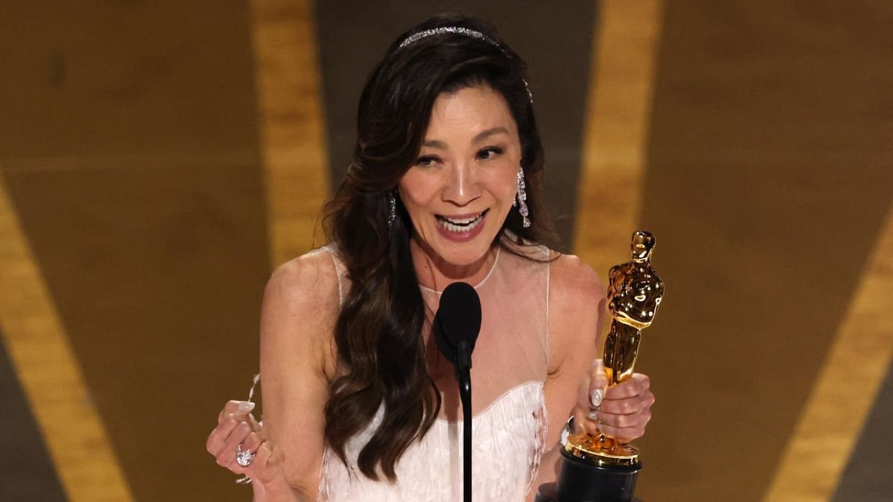 Michelle Yeoh accepts the Oscar for Best Actress for "Everything Everywhere All at Once". Credit: Reuters Photo