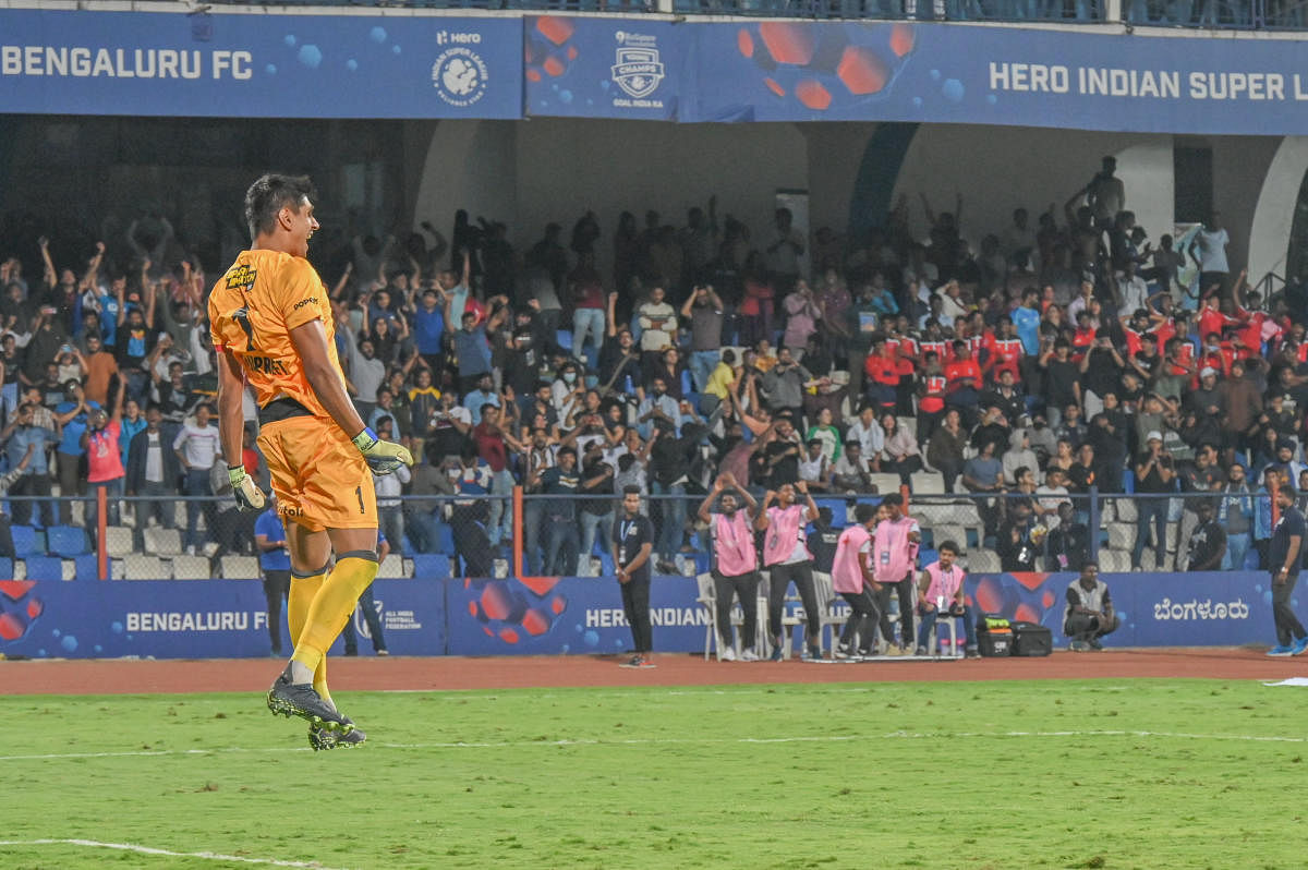 Bengaluru FC goalkeeper Gurpreet Singh Sandhu reacts after saving penalty in the shootout, sending the fans into delirium. Credit: DH Photo/ S K Dinesh