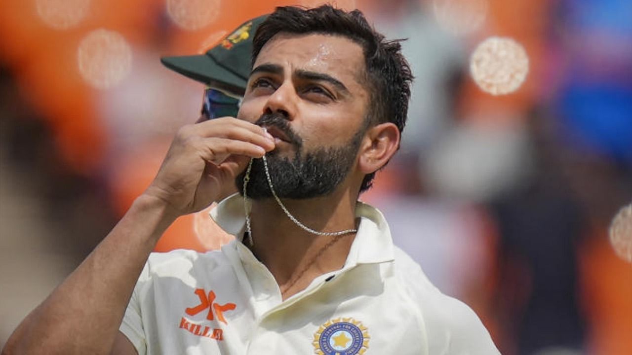 Virat Kohli celebrates after scoring a century during the 4th day of the fourth test cricket match between India and Australia, at Narendra Modi Stadium, in Ahmedabad, Sunday, March 12, 2023. Credit: PTI Photo