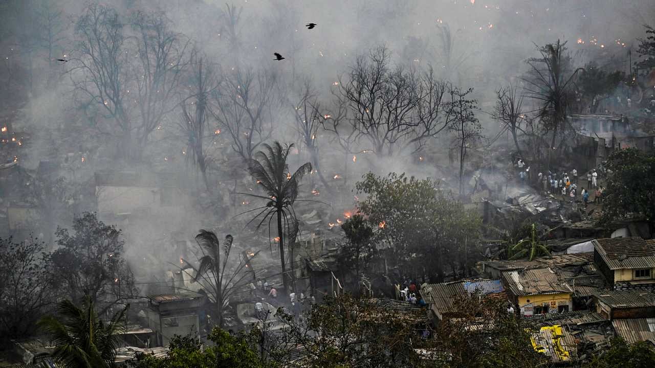 Smoke billows out after a fire broke out in Anand Nagar, Malad, in Mumbai. Credit: PTI Photo