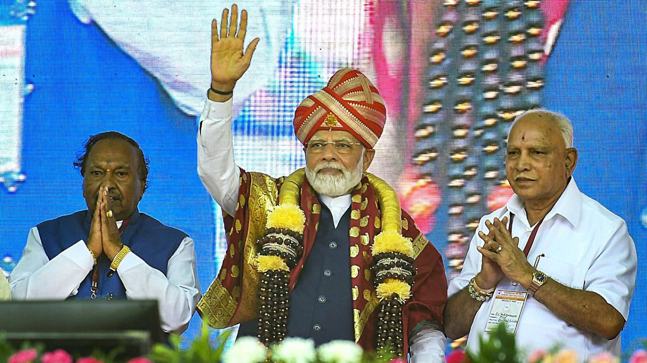 Prime Minister Narendra Modi with former Karnataka chief minister B.S. Yediyurappa (right) and BJP leader K.S Eshwarappa (left). Credit: PTI Photo