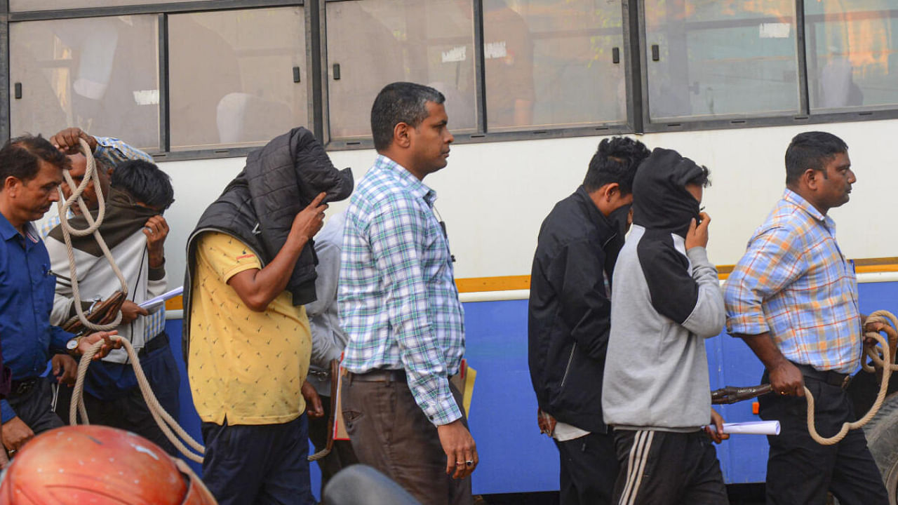 Accused persons in the board exam paper leak being produced in a court in Guwahati, Wednesday, March 15, 2023. Credit: PTI Photo