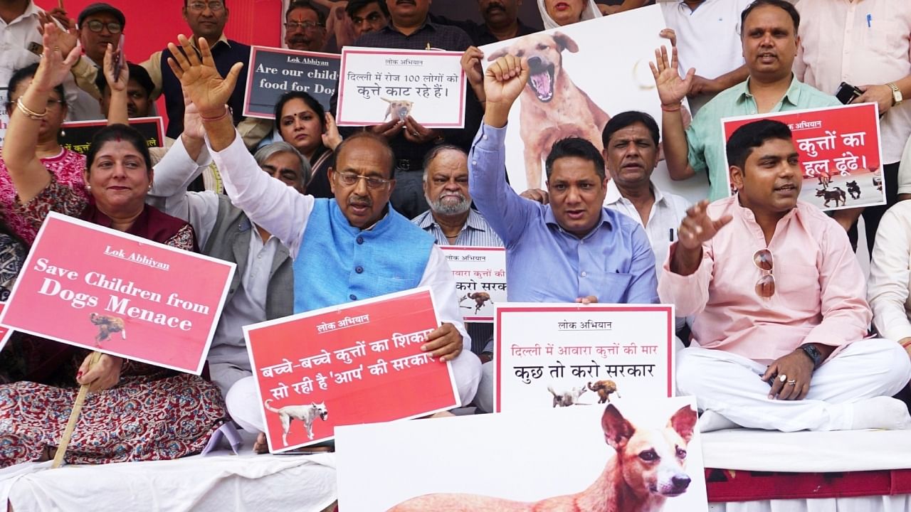 BJP leader Vijay Goel and party members hold a demonstration against the menace of street dogs in Delhi, March 15, 2023. Credit: IANS Photo