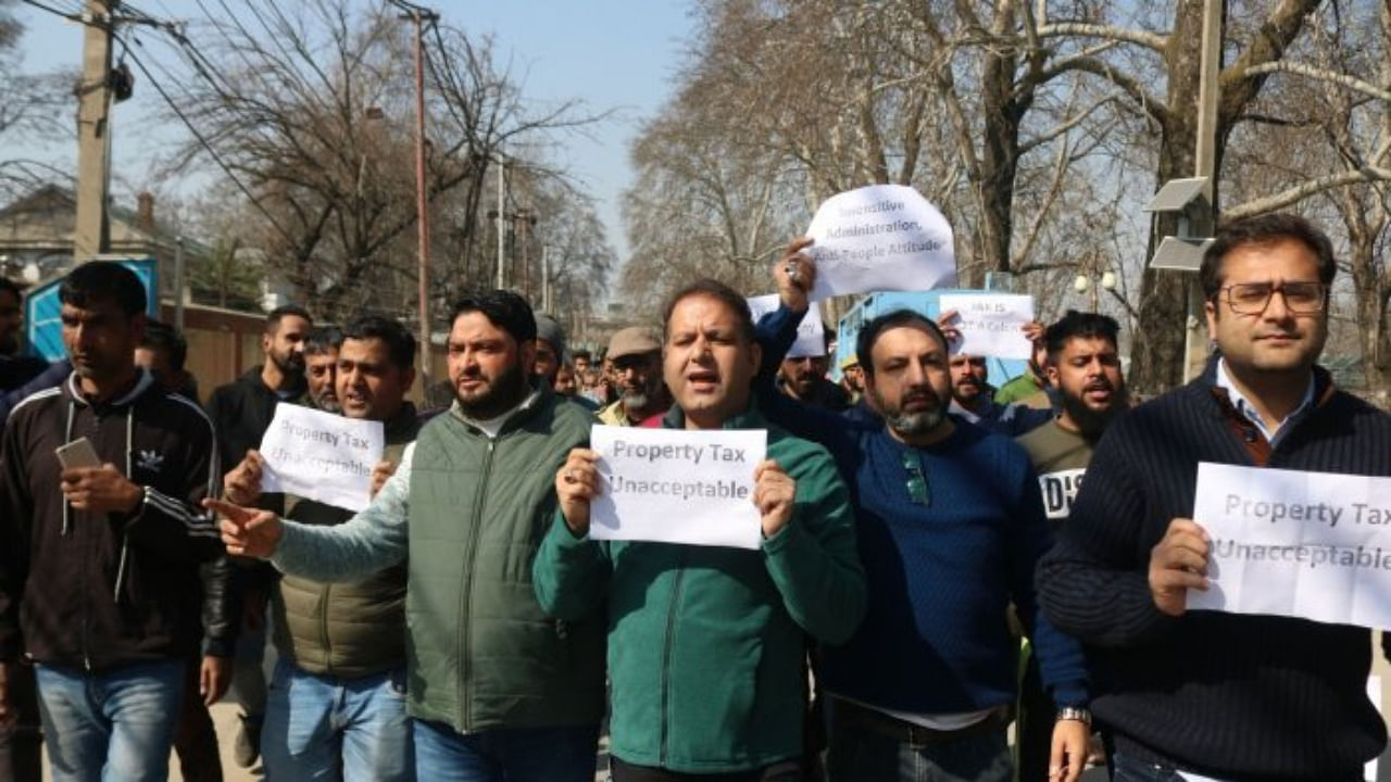 Members of PDP took out a protest march and demand roll-back of the Jammu and Kashmir administration's decision to impose property tax in the Union Territory, in Srinagar on Saturday. Credit: IANS Photo