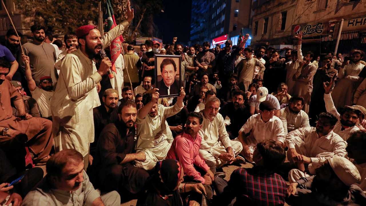 Supporters of former Pakistani PM Khan protest ahead of Khan's possible arrest in Lahore. Credit: Reuters Photo