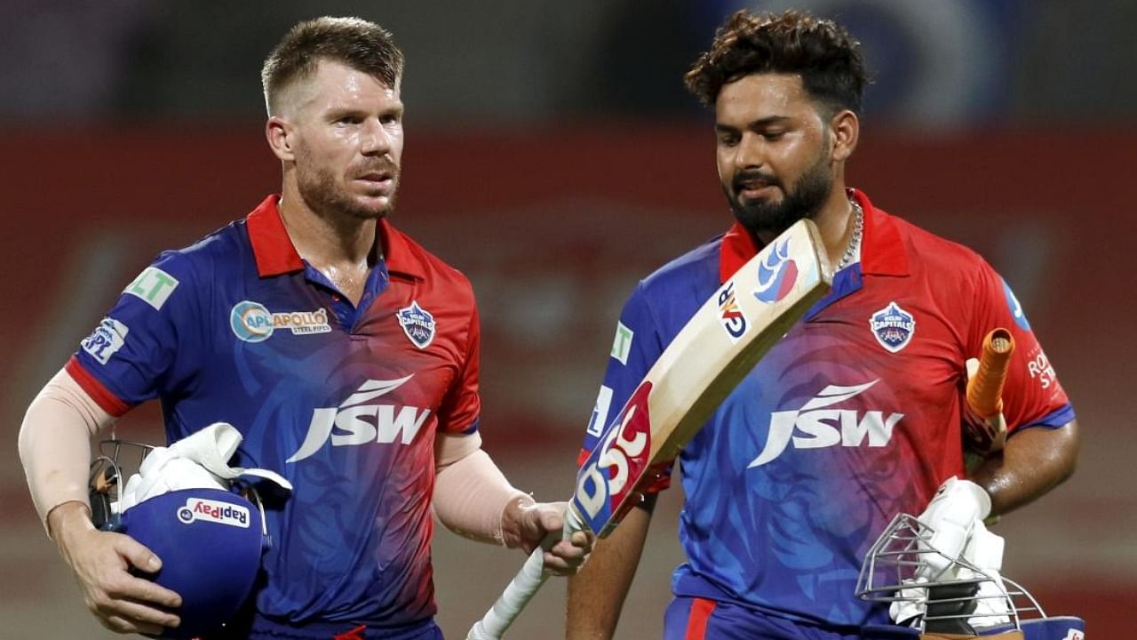 File photo of David Warner and Rishabh Pant at a match of Delhi Capitals. Credit: PTI Photo