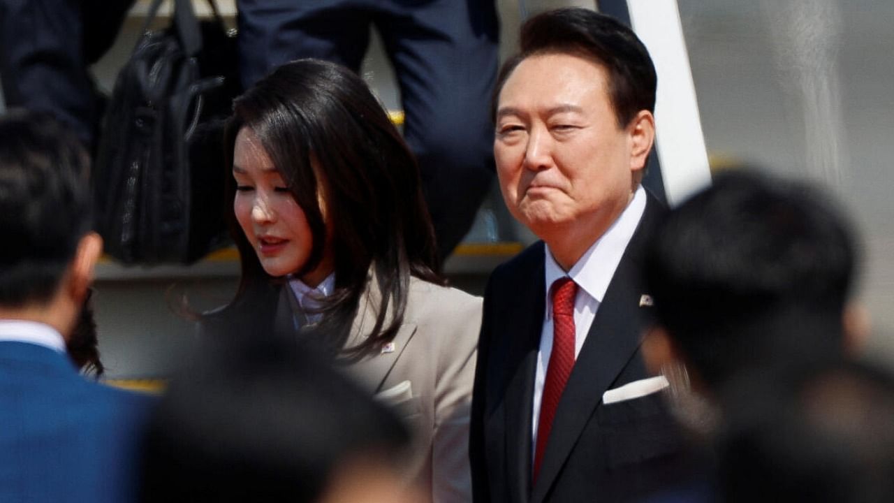 South Korea's President Yoon Suk Yeol and his wife Kim Keon-hee look on at Tokyo International Airport. Credit: Reuters Photo