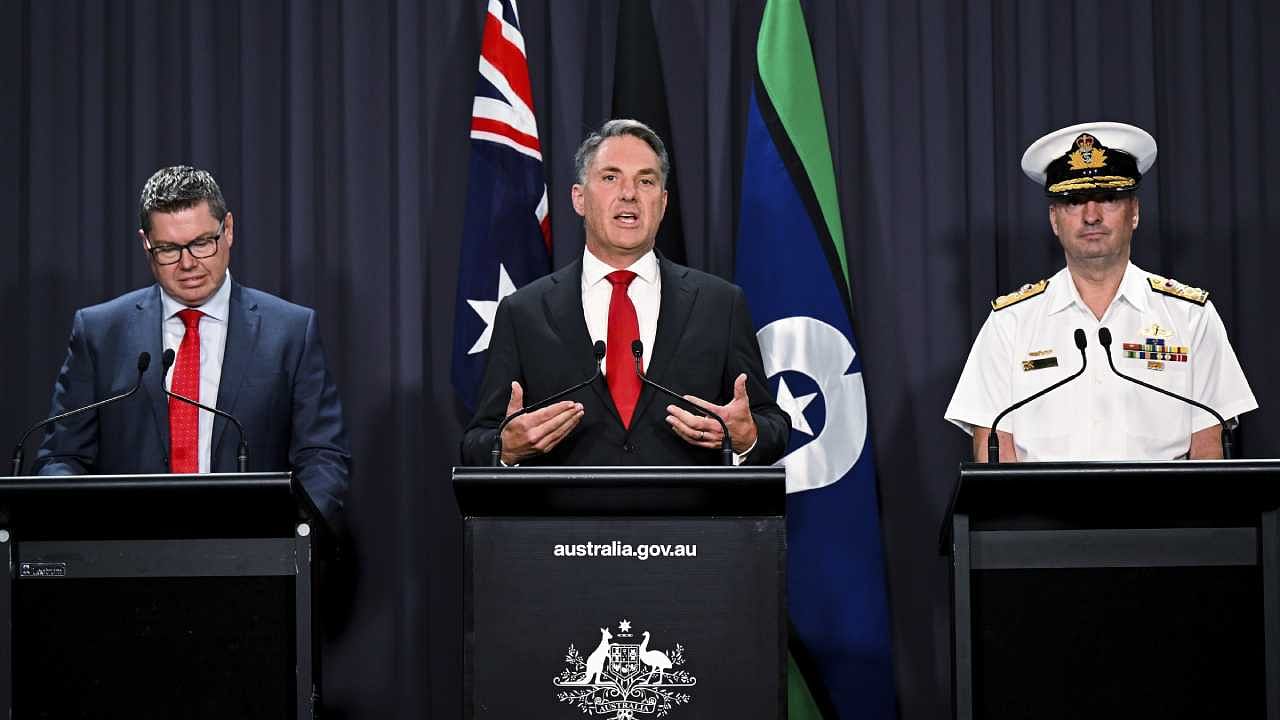 Australian Defense Industry Minister Pat Conroy, Australian Deputy Prime Minister Richard Marles and head of the Nuclear Powered Submarine Task Force Vice Adm. Jonathan Mead speak to the media during a press conference at Parliament House in Canberra. Credit: AP/PTI Photo