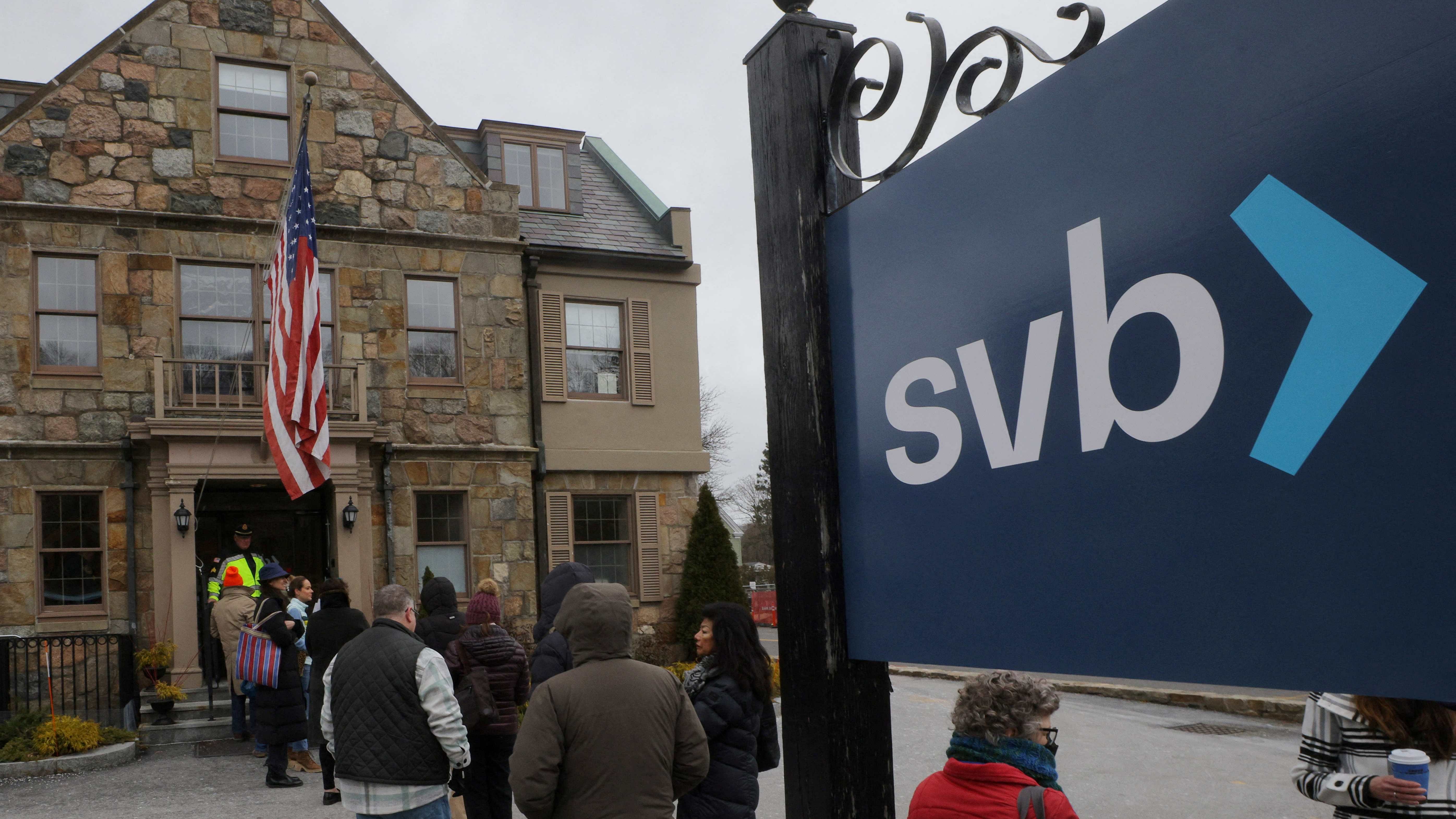 Customers wait in line outside a branch of the Silicon Valley Bank in Wellesley, Massachusetts, US. Credit: Reuters Photo