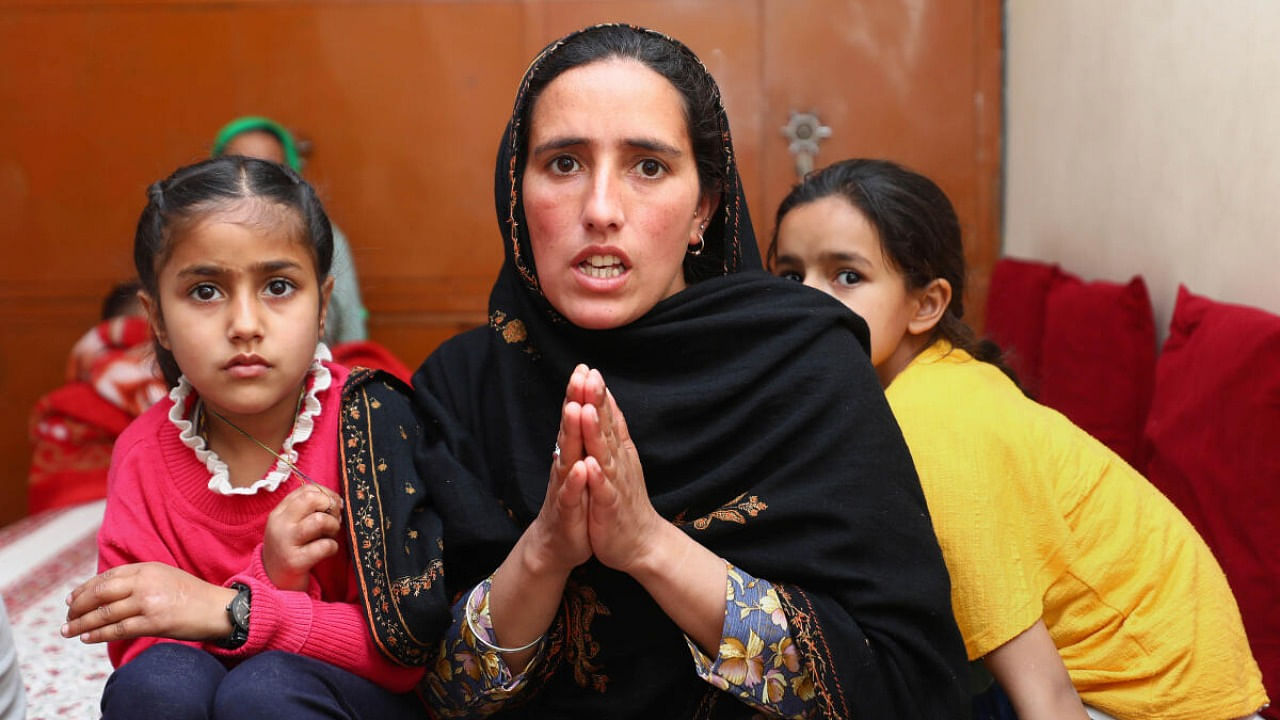  Family members of a Kashmiri Pandit Sanjay Sharma, who was killed in a terrorist attack, seek their rehabilitation, in Jammu, Friday, March 17, 2023. Credit: PTI Photo